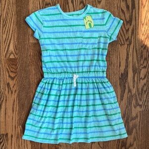 New with tag, blue and green striped Primary dress size 6-7. Ships quickly.